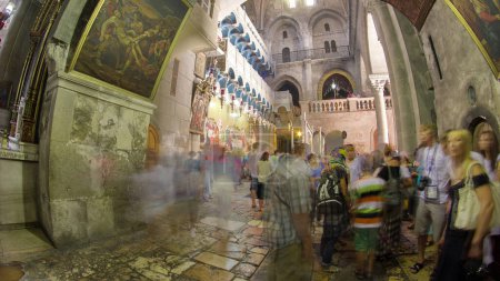 Photo for Stone of Anointing in the Church of the Holy Sepulcher timelapse hyperlapse. Sacred place in the Christian Quarter of the Old City of Jerusalem where Jesus was crucified and buried. - Royalty Free Image