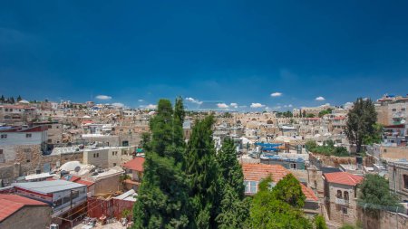 Skyline of the Old City in Jerusalem with historic buildings aerial view from Austrian Hospice Rooftop timelapse hyperlapse, Israel. Middle east