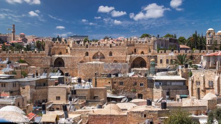 Skyline of the Old City in Jerusalem with historic buildings and Damascus gate aerial timelapse from Austrian Hospice Rooftop, Israel. Middle east.