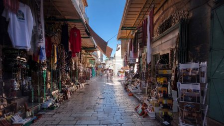 Photo for The colorful souk near Holy Sepulchre in the old city of Jerusalem Israel timelapse hyperlapse. Crowd of people passing by on this market - Royalty Free Image