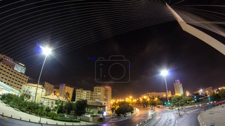 Photo for View from the bridge by Santiago Calatrava night timelapse hyperlapse at the entrance to Jerusalem. Traffic on the road - Royalty Free Image