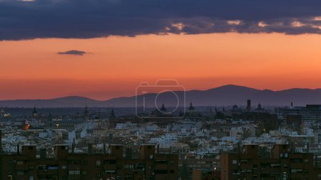 Photo for Panoramic day to night transition timelapse view of Madrid, Spain from the hills of Tio Pio Park, Vallecas-Neighborhood. - Royalty Free Image