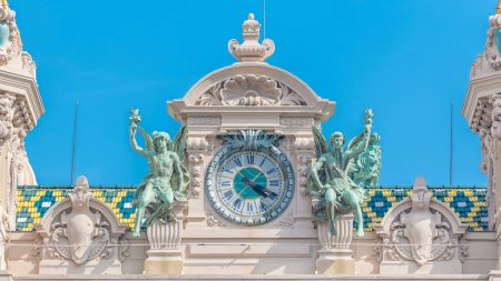 lock on top of the 19th century baroque style palace of the Monte Carlo Casino timelapse in Monaco. Blue sky at summer day