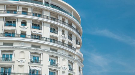 Photo for Monte Carlo with the view to the top facade of luxury Hotel de Paris timelapse, Monaco. Close up. Blue cloudy sky at summer day - Royalty Free Image