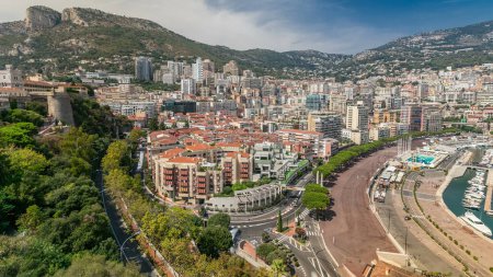 Photo for Panorama of Monte Carlo aerial timelapse from the observation deck in the village of Monaco near Port Hercules. Rooftops of houses and buildings and hills on background top view - Royalty Free Image