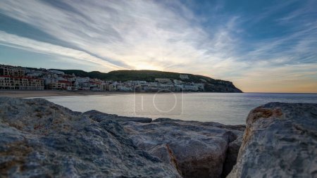 Sunrise from pier at small town of Sesimbra Portugal, panoramic timelapse