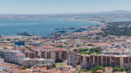 Lisbon with fleet ship on the Tagus river bank, central Portugal aerial timelapse from viewpoint statue of Christ
