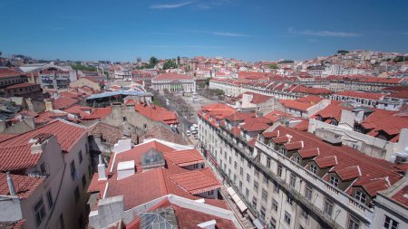 Rossio square in the central Lisbon with a monument of the king Pedro IV from Santa Justa Elevator. Portugal. Aerial timelapse from top