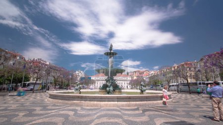 Photo for The National Theatre D. Maria and fountains in front of it. Theatre is situated on Rossio Square, one of the most famous squares in the center of Lisbon, Portugal timelapse hyperlapse - Royalty Free Image