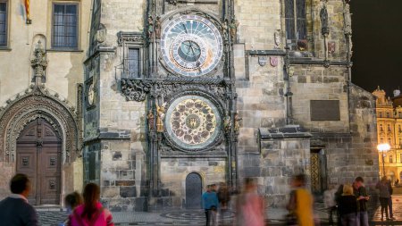 Photo for Night view of the medieval astronomical clock in the Old Town square timelapse in Prague. People watching the show - Royalty Free Image