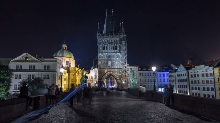 Photo for Magnificent Gothic structure called Stare Mesto Tower timelapse hyperlapse, was built in 14th century, fitting ornament to the new Charles Bridge (Karluv Most). Prague, Czech Republic - Royalty Free Image