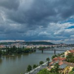 Aerial panoramic view of Prague timelapse from the observation deck of Visegrad. Prague. Czech Republic. Vltava river and bridges. Stormy weather with dark clouds