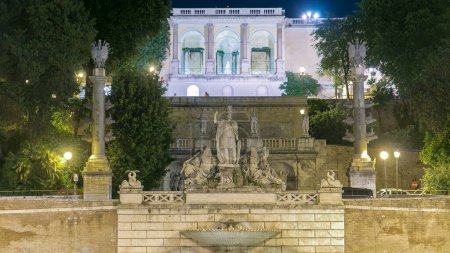 illuminated fountain of Dea Roma night timelapse in Piazza del Popolo with Pincio terrace in the background