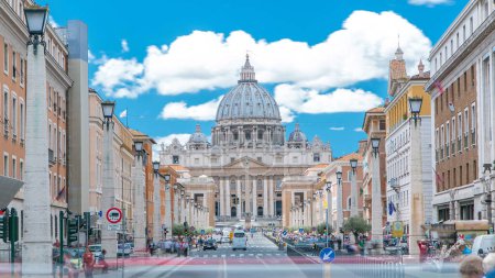 Photo for Vatican timelapse: St. Peter's Basilica in Vatican City State view from Via della Conciliazione, Road of the Conciliation. Blue cloudy sky with traffic on the road. Rome, Italy - Royalty Free Image