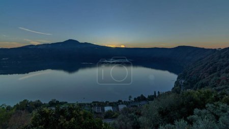 Dawn over Albano Lake: Panoramic Timelapse of the Coast at Sunrise, Rome Province, Latium, Central Italy. Morning Light Paints the Landscape with the Verdant Beauty of Green Trees