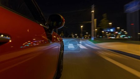 Photo for Car moves at fast speed at the night streets timelapse hyperlapse drivelapse. Blurred road with lights reflected from car on high speed. Prague, Czech - Royalty Free Image