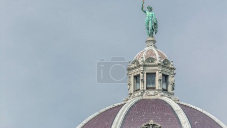 Sculpture on top of famous Naturhistorisches Museum (Natural History Museum) timelapse with blue sky in Vienna, Austria. Close up view to dome