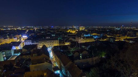 Old town of Zagreb at night timelapse. Zagreb, Croatia. Top panoramic view from Kula Lotrscak tower viewpoint with illuminated streets