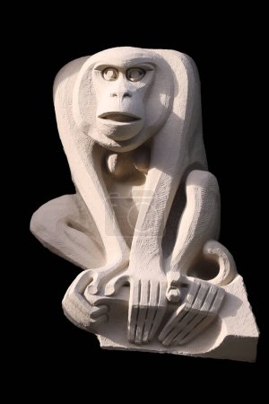 Photo for Sculpture of young monkey on black background - Royalty Free Image