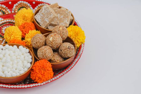 Photo for Happy Makar Sankranti, Pongal and Uttarayan, haldi kum kum bowls and tilgul sweets - Royalty Free Image
