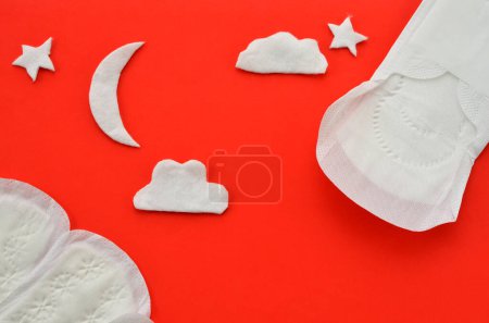 Photo for Women's pads on a red background, concept of protection at night - Royalty Free Image