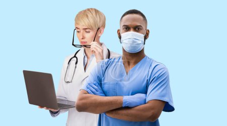Photo for Medical Workers Portraits. Collage With Multiethnic Male And Female Doctors In Uniform Standing Isolated Over Blue Background, Female Therapist Holding Laptop, Black Physician Man Looking At Camera - Royalty Free Image