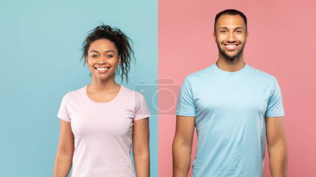 Téléchargez les photos : Portrait of happy african american couple looking at camera and smiling, posing standing over blue and pink halved studio background, panorama - en image libre de droit
