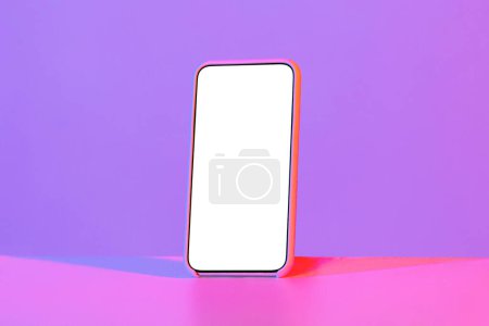 Foto de Phone display with white empty screen. Brand new smartphone in phone case isolated on neon studio background, mockup, copy space. Technologies, gadgets, mobile application, online offer concept - Imagen libre de derechos