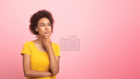 Thoughtful pensive millennial multiethnic woman in casual pondering, thinking, looking at empty space isolated on pink background, studio, panorama. Choice for study, work, creating idea, ad and offer