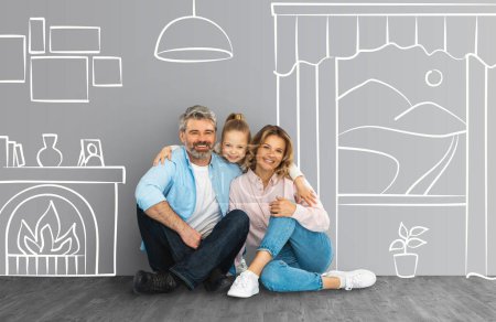 Photo for Beautiful caucasian family dreaming about their own house, happy cute little daughter hugging her smiling mother and father, sitting on floor over house sketch made with chalk on board, collage - Royalty Free Image