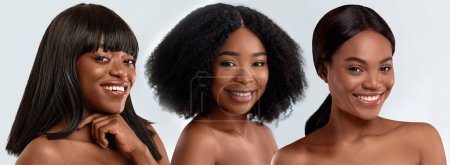 Foto de Beauty and body care. Three happy young beautiful dark-skinned women posing half-naked over grey studio background, cheerfully smiling at camera, banner for beauty website - Imagen libre de derechos