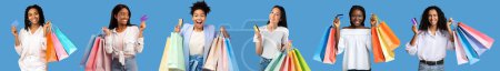 Foto de Satisfied surprised excited diverse millennial women with many packages with purchases show credit card, enjoy shopping isolated on blue background, studio, panorama. Emotions from sale, ad and offer - Imagen libre de derechos