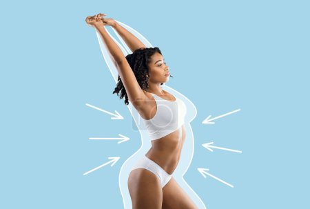 Photo for Serious young slim black lady in white lingerie enjoys weight loss result with fat abstract body around and arrows isolated on blue wall background, studio. Before and after, health, body care, diet - Royalty Free Image
