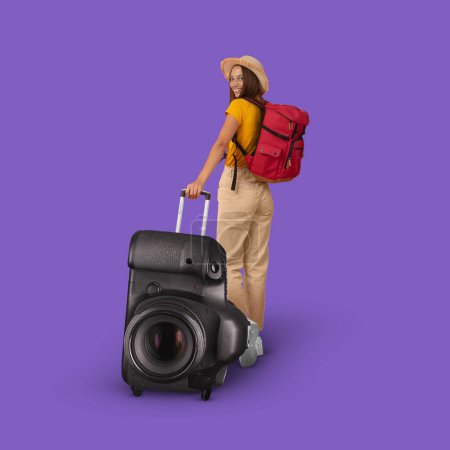 Photo for Happy young european woman in hat with backpack walking with huge photo camera suitcase on violet studio background, full length, copy space, collage. Tourist enjoy trip, journey at weekend, vacation - Royalty Free Image