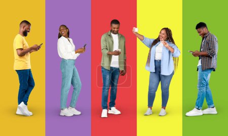 Photo for App for blog and social networks. Happy adult black people in casual chatting on smartphone, taking selfie on colorful background, studio, panorama, full length. Modern gadget, surfing, ad and offer - Royalty Free Image