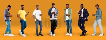 Foto de Glad young black men in casual and suit typing on smartphone, use app for work, study and business, on orange background, studio, panorama. Lifestyle, communication online, gadget for social networks - Imagen libre de derechos