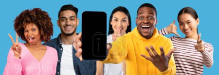 Photo for Great news, win and offer. Glad excited millennial different guys and women show smartphone with blank screen make peace and shhh gesture, recommend website, app isolated on blue background, studio - Royalty Free Image