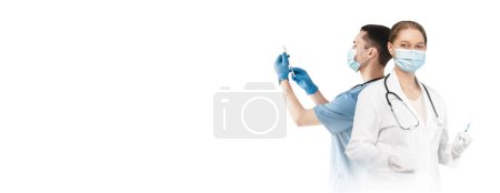 Photo for Banner For Vaccination Campaign With Two Doctors Holding Syringes Standing Isolated Over White Background, Creative Collage Of Man And Woman Medical Workers In Uniform And Face Masks, Copy Space - Royalty Free Image
