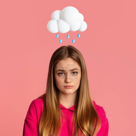 Photo for Unhappy sad teen caucasian lady with abstract cloud and rain sign above head isolated on pink studio background. Bad mood, depression, PMS, negative human emotion and facial expression - Royalty Free Image