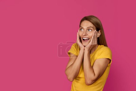 Photo for Amazed happy shocked middle aged european blonde female with open mouth looking at free space, isolated on pink studio background. People emotions, success, great news, surprise and win - Royalty Free Image