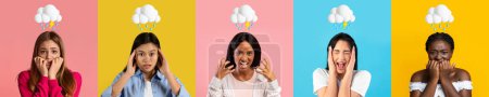 Photo for Scared shocked young international women with lightning cloud and rain overhead isolated on wall studio background. Afraid, negative emotions, bad mood, freaking out, problems and stress - Royalty Free Image