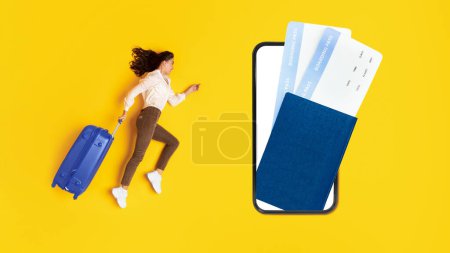 Photo for Travel App. Tourist Lady Running To Huge Smartphone With Boarding Passes On Screen, Posing With Suitcase On Yellow Background. Traveler Booking Cheap Trip Tickets Via Phone. Panorama, Collage - Royalty Free Image