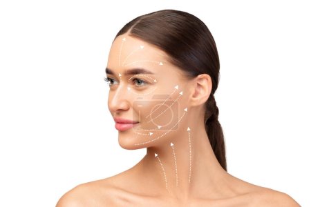 Facelift Routine. Portrait Of Young European Lady With Lifting Arrows Lines On Face Over White Studio Background, Looking Aside. Effortless Facial Skincare And Anti Aging Renewal Treatment Concept