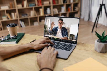 Photo for Unrecognizable man studying foreign language from home, having video chat with tutor, typing on keyboard while sitting at desk at home office, copy space for ad, collage - Royalty Free Image