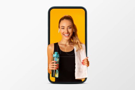Photo for Happy young caucasian woman in sportswear wireless headphones drinks bottle of water on phone screen isolated on white studio background, collage. Diet, hydratation, fitness workout, weight loss - Royalty Free Image