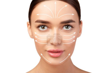Lifted and Rejuvenated. Pretty Young Womans Face With Lifting Arrows On Perfect Smooth Skin, Beauty Portrait On White Studio Background. Plastic Surgery And Antiaging Facial Massage Concept