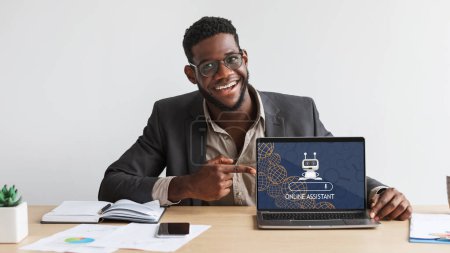 Photo for Chat with AI, Artificial Intelligence. Cheerful young black man wearing eyeglasses working on laptop, using Online Assistant, Chatbots, artificial intelligence developed by OpenAI - Royalty Free Image