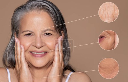 Photo for Cheerful old caucasian lady with gray hair touches face with hands, close up of skin problems, enjoy anti-aging treatment, isolated on brown background, studio. Beauty care, wrinkle in menopause - Royalty Free Image