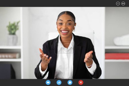 Photo for Screenshot of friendly african american female psychologist giving online consultation, video chatting with clients, gesturing to webcamera and smiling - Royalty Free Image