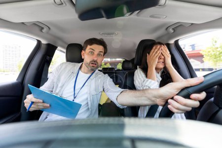 Photo for Distressed millennial man auto instructor takes exam in young woman. Avoiding car crash. Scared young woman cover her face with hands. Instructor drives car in stressful situation - Royalty Free Image